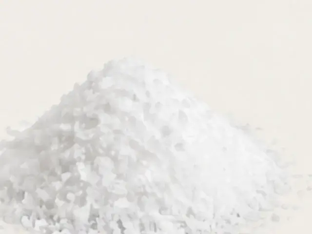 A pile of white L-lysine powder