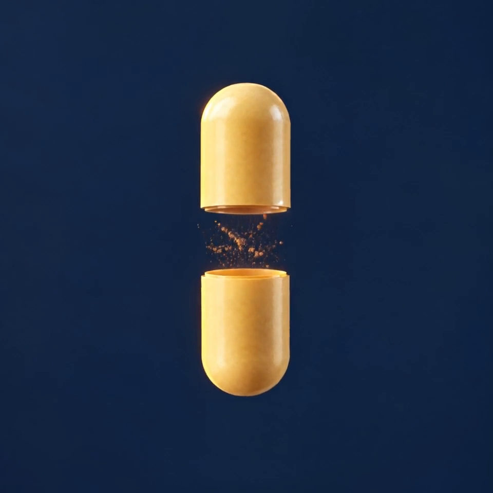 A Ferritas capsule split open into two halves, with iron powder between them.